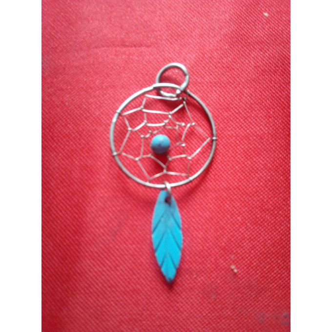 Pendentif Capteur avec sa plume bleu